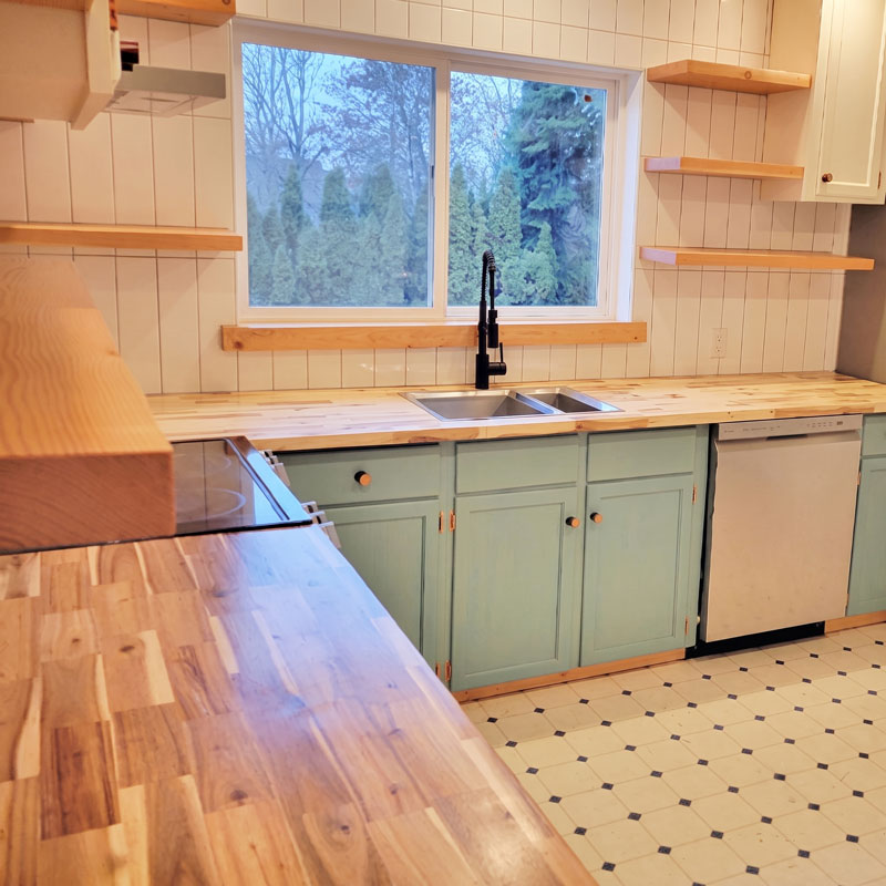 Interior finish carpentry featuring a custom wood butcher block countertop installation.<br />